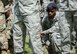 A U.S. Airman takes a knee in recognition of a fallen police services member during Police Week 2018 on Vogelweh Air Station, Germany, May 18, 2018. The symbolic action was part of the retreat ceremony, which concluded Police Week, and honored fallen police services members everywhere. (U.S. Air Forces photo by Senior Airman Elizabeth Baker)