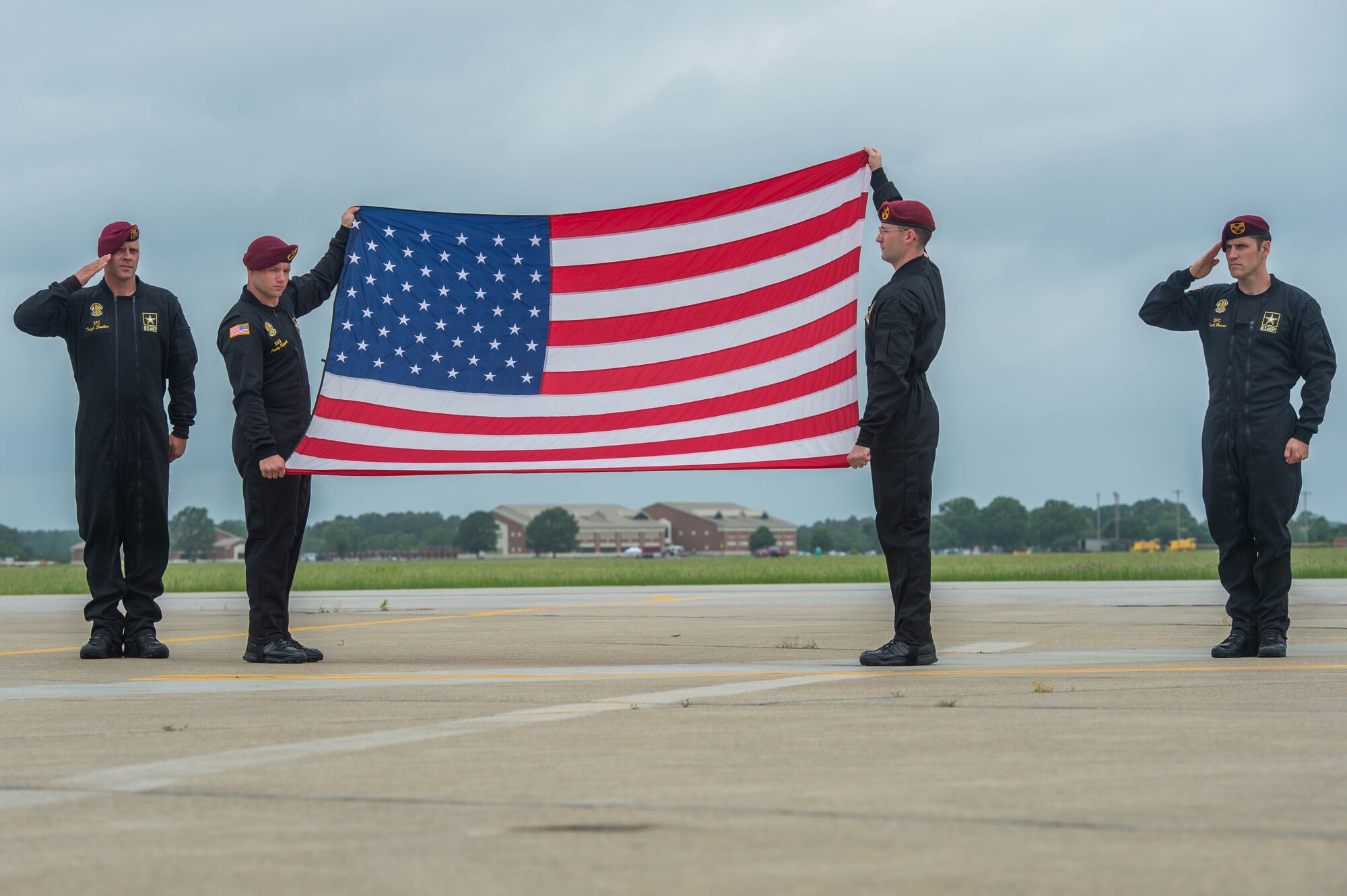 Members assigned to the U.S. Army Golden Knights, display an American flag during the opening ceremony at AirPower Over Hampton Roads JBLE Air and Space Expo at Joint Base Langley-Eustis, Virginia, May 19, 2018.