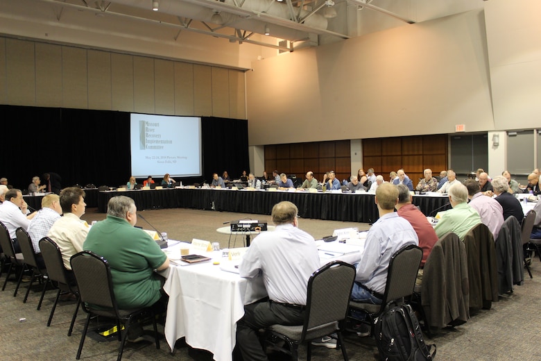 Members of the Missouri River Recovery Implementation Committee sitting around a large table.