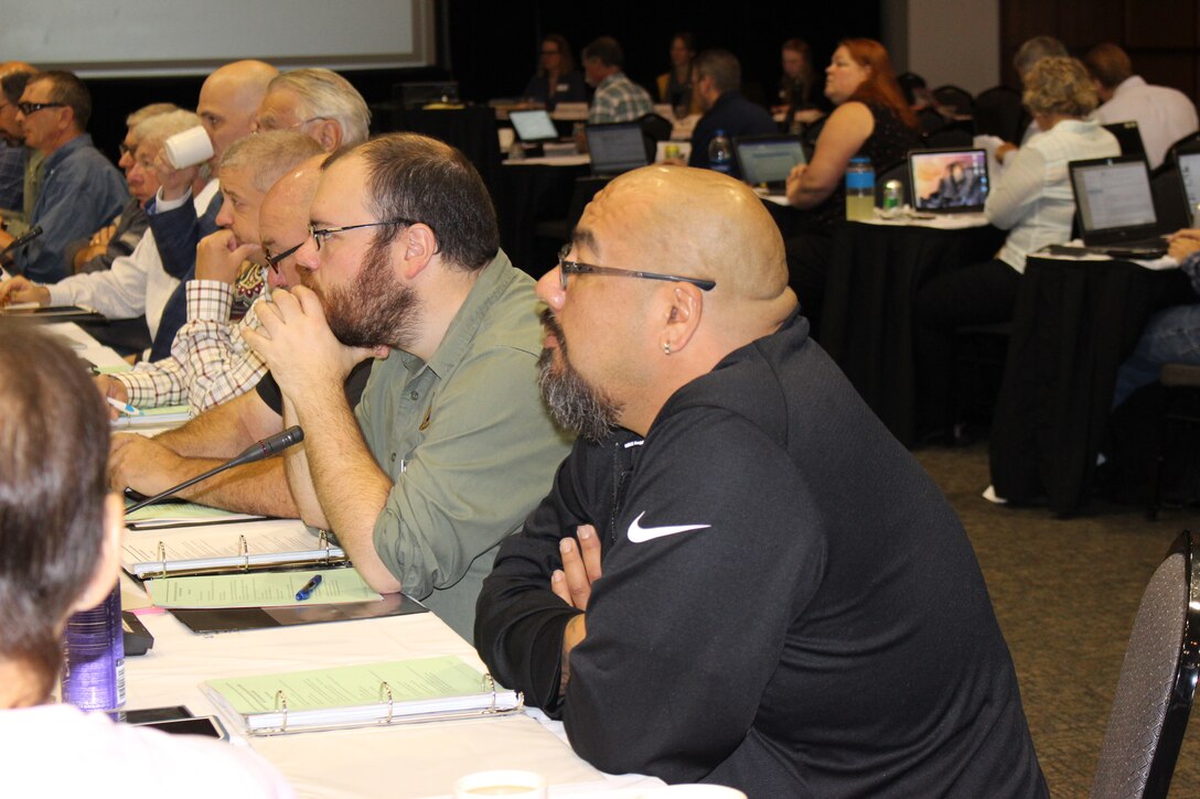 Members of the Missouri River Recovery Implementation Committee sitting around a large table.