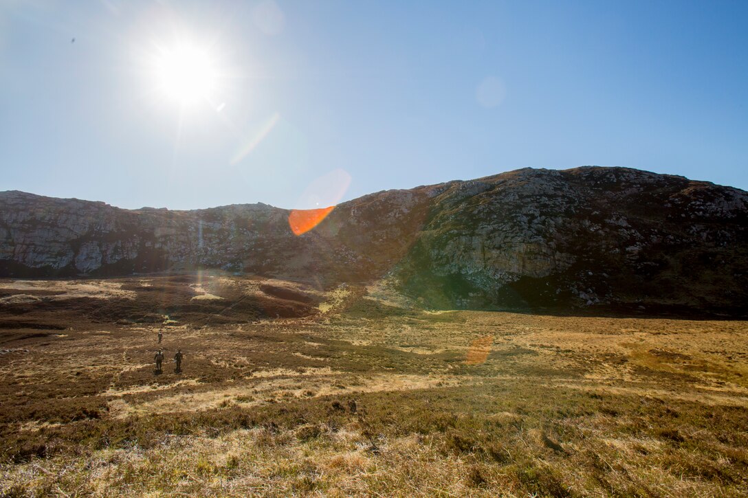 U.S. Marines and Sailors, bottom left, with the 4th Air Naval Gunfire Liaison Company (ANGLICO), Force Headquarters Group, begin their trek up a mountain to their first checkpoint as they take part in a land navigation exercise in Durness, Scotland, April 30, 2018.