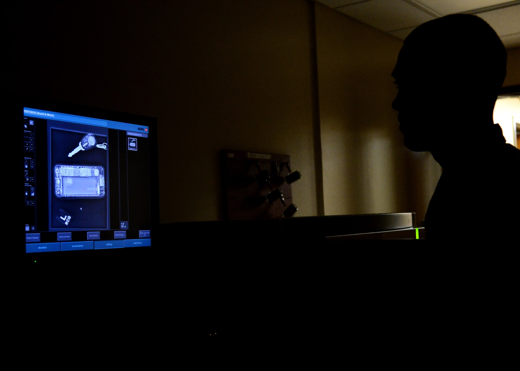 Staff Sgt. Ryan Gulland, a 28th Medical Support Squadron diagnostic imaging technician, looks over a test image on the image processor inside the 28th Medical Group at Ellsworth Air Force Base, S.D., May 11, 2018. Once an image is captured, a cassette is placed in the processor and the image generates on screen for review. (U.S. Air Force photo by Senior Airman Denise Jenson)