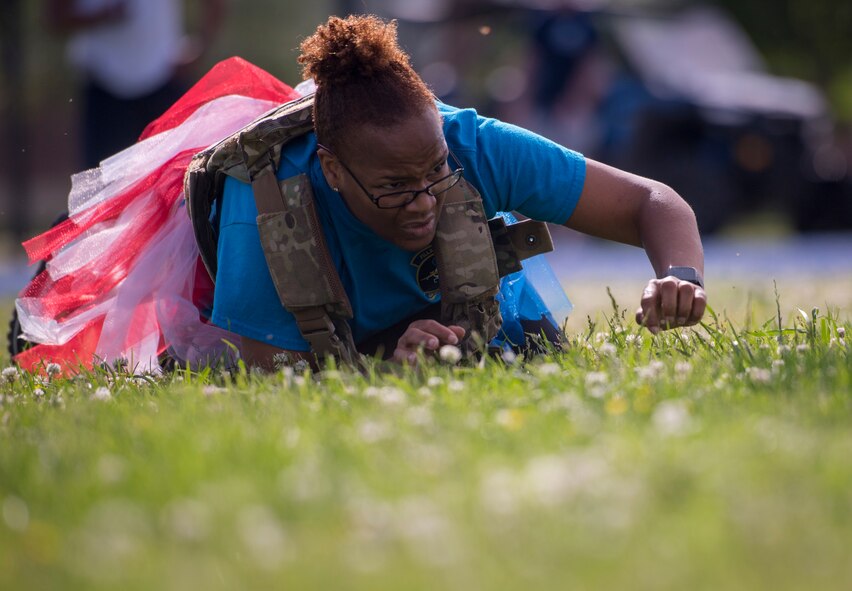 U.S. Air Force Lt. Col. Alisha Smith, 633rd Medical Support Squadron commander, low crawls during the National Police Week Defenders’ Challenge at Joint Base Langley-Eustis, Virginia, May 16, 2018.