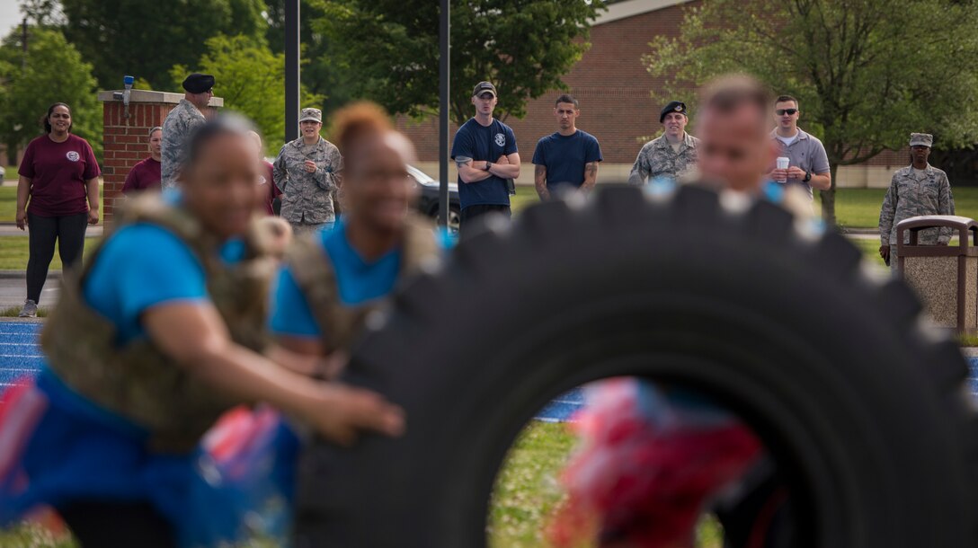 Spectators and competing teams look on as the 633rd Medical Support Squadron team competes in the National Police Week Defenders’ Challenge at Joint Base Langley-Eustis, Virginia, May 16, 2018.