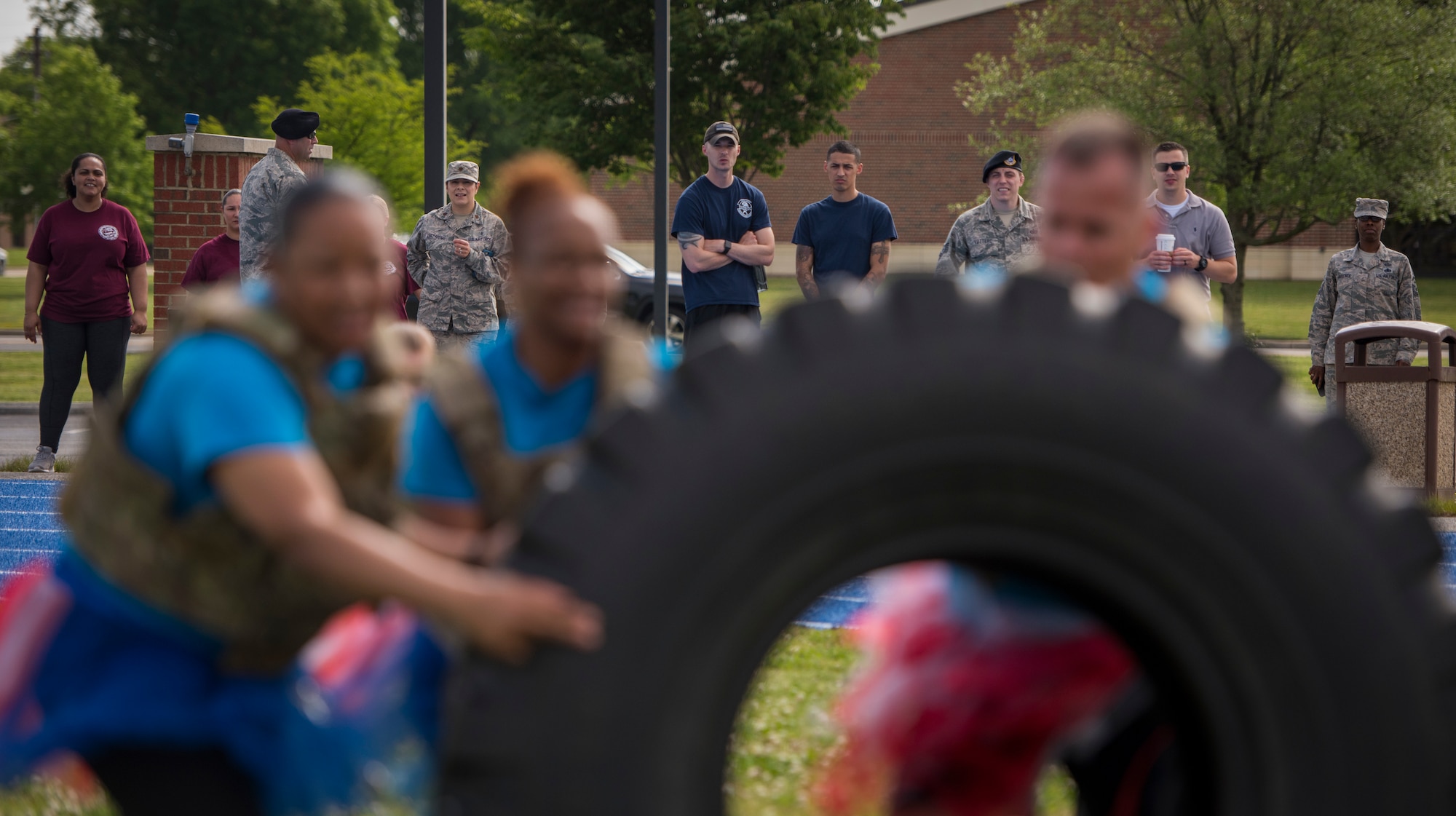 Spectators and competing teams look on as the 633rd Medical Support Squadron team competes in the National Police Week Defenders’ Challenge at Joint Base Langley-Eustis, Virginia, May 16, 2018.