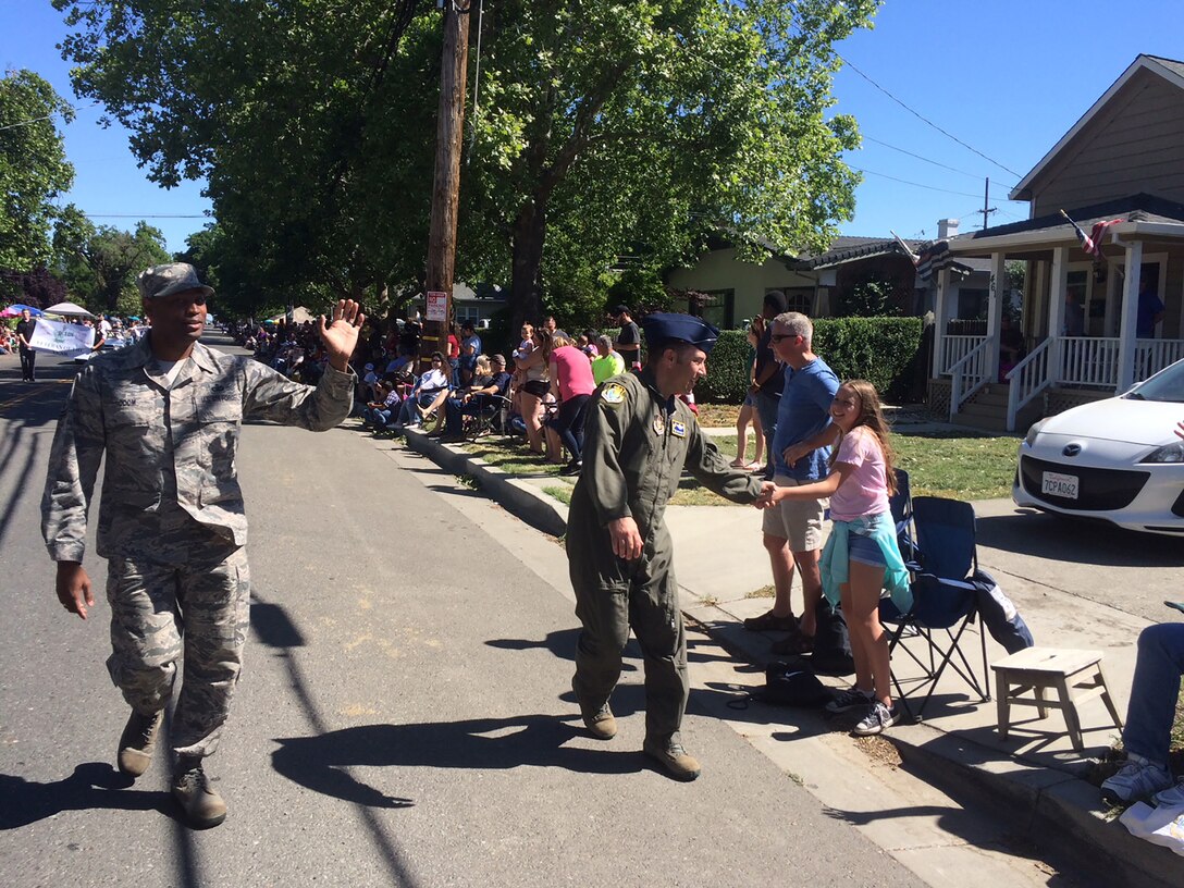 A group of about 50 Travis Air Force Base Airmen marched in the Dixon Mayfair parade, May 12, 2018, to the delight of the clapping and whistling crowd, excitedly waving small American flags, shouting out, “Thank you for your service.”