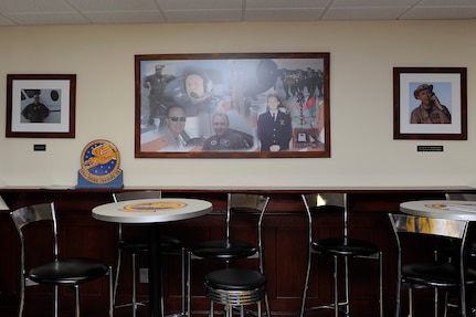 Photos of Maj. Jeff ‘Oz’ Ausborn fill a wall within the memorial heritage room at the 99th Flying Training Squadron at Joint Base San Antonio-Randolph, Texas, April 27, 2018. Ausborn was deployed from JBSA-Randolph and killed April 27, 2011, in Kabul, Afghanistan, when a shooter opened fire at the Kabul International Airport, killing eight Airmen and one American contractor. (U.S. Air Force photo by Tech. Sgt. Ave I. Young)