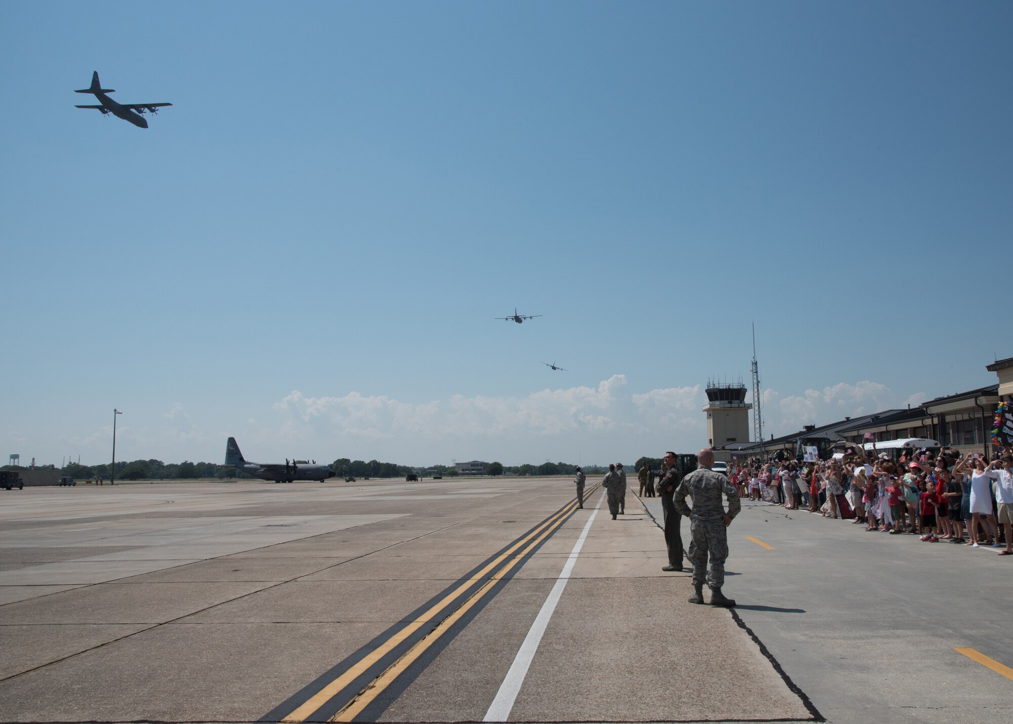 Air Force reservists with the 403rd Wing, Keesler Air Force Base, Mississippi, arrive in a four-ship C-130J Super Hercules formation. The aircraft were flown by 815th Airlift Squadron crews who, along with several wing members, returned from a deployment to Southwest Asia in support of Operations Freedom Sentinel and Inherent Resolve. (U.S. Air Force photo/Maj. Marnee A.C. Losurdo)
