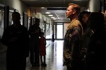 Wearing the Army combat uniform, Lt. Col. Jason Powell, Air Education and Training Command deputy director for safety, leads the roll call for the NATO Air Training Command Afghanistan, NATC-A NINE, April 27, 2018, Randolph AFB, Texas. Powell was on the next rotation that followed this tragic event and has flown with the 99th FTS for the last four years. Among the victims was Maj. Jeff ‘Oz’ Ausborn, who was deployed from the 99th FTS. (U.S. Air Force photo by Tech. Sgt. Ave I. Young)