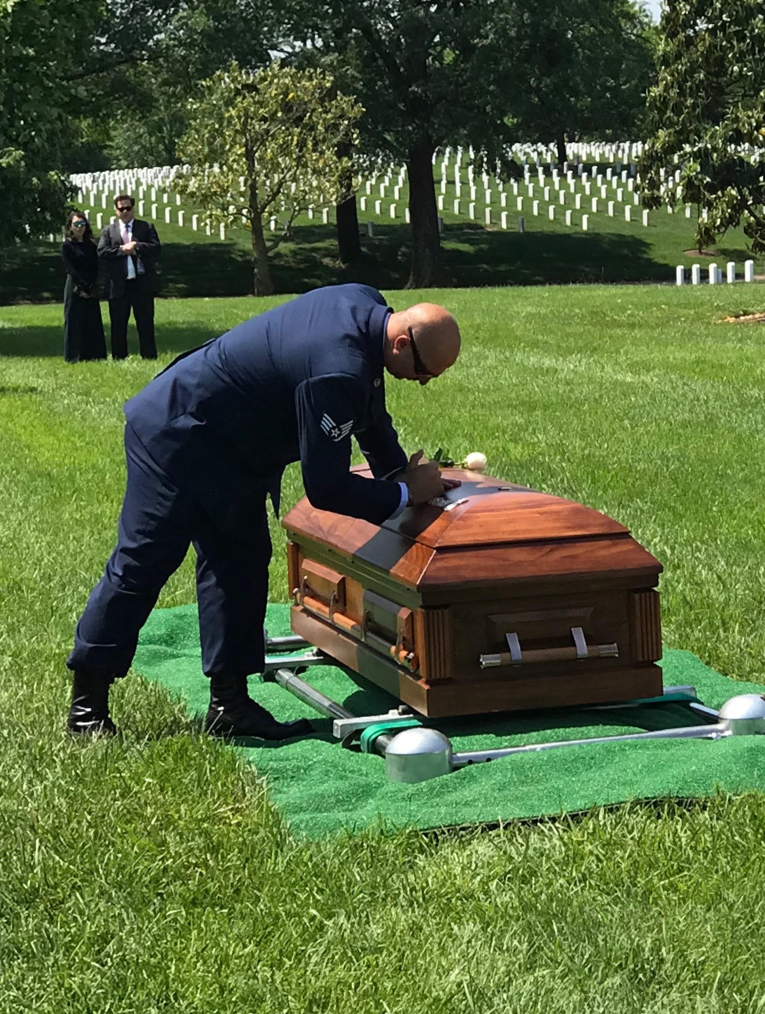 Staff Sgt. Brandon Forshaw, pararescueman, 308th Rescue Squadron, along with other colleagues, friends and loved ones, paid final respects to fallen pararescueman Staff Sgt. Carl Enis at Arlington National Cemetery May 21, 2018. In a time-honored tradition, members of the elite Guardian Angel triad of pararescue, press their pararescue flash taken from their maroon berets, into the lid of the casket to honor their fallen teammate. Enis was providing combat rescue support for Inherent Resolve, when he, along with six other Airmen, was killed in an HH-60G Pave Hawk helicopter crash in Anbar Province, Iraq, March 15, 2018. The Guardian Angel triad consists of pararescuemen, combat rescue officers and SERE or survival specialists who are expert swimmers, SCUBA divers, mountain climbers, parachutists, marksmen and trauma medics who are uniquely capable of performing rescues anywhere in the world. The 308th Rescue Squadron is part of the 920th Rescue Wing at Patrick Air Force Base, located in Cocoa Beach, Florida. (Courtesy photo)