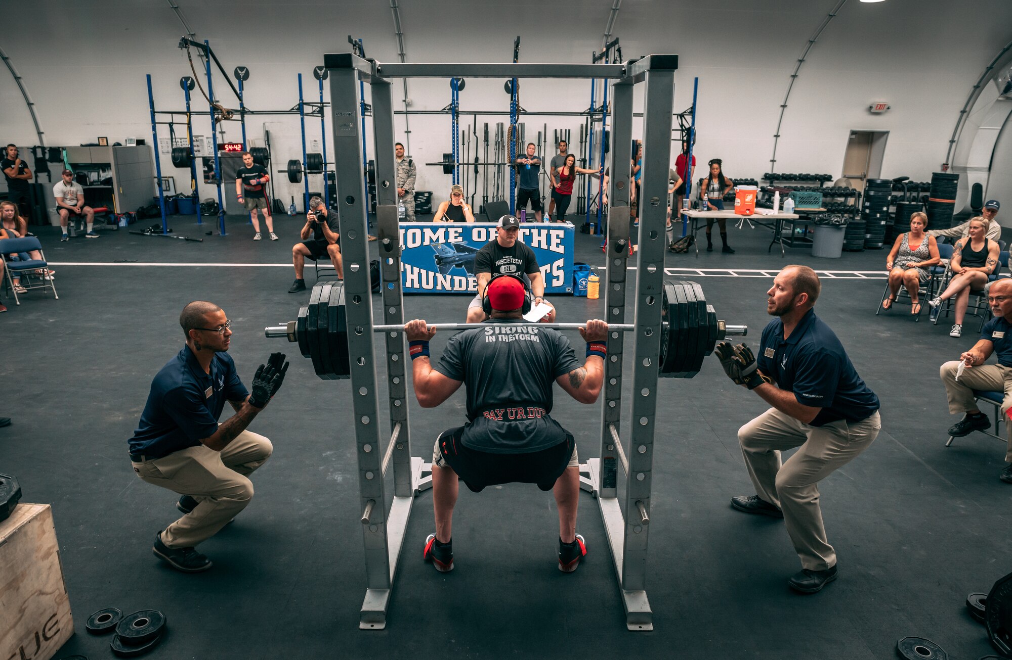 Staff Sgt. Thomas Penny, 56th Component Maintenance Squadron aircraft fuel systems craftsman, performs a squat during the Luke Air Force Base Powerlifting Competition at Luke AFB, Ariz., May 18, 2018. The competition consisted of workouts to include bench presses, squats, and deadlifts. (U.S. Air Force photo by Airman 1st Class Alexander Cook)