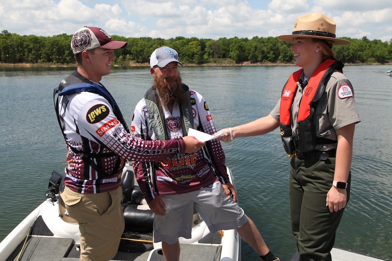 Kansas City District, Corps of Engineer Park Ranger Gina Pate provided boating safety information to these two boaters at Stockton Lake May 18, 2018.