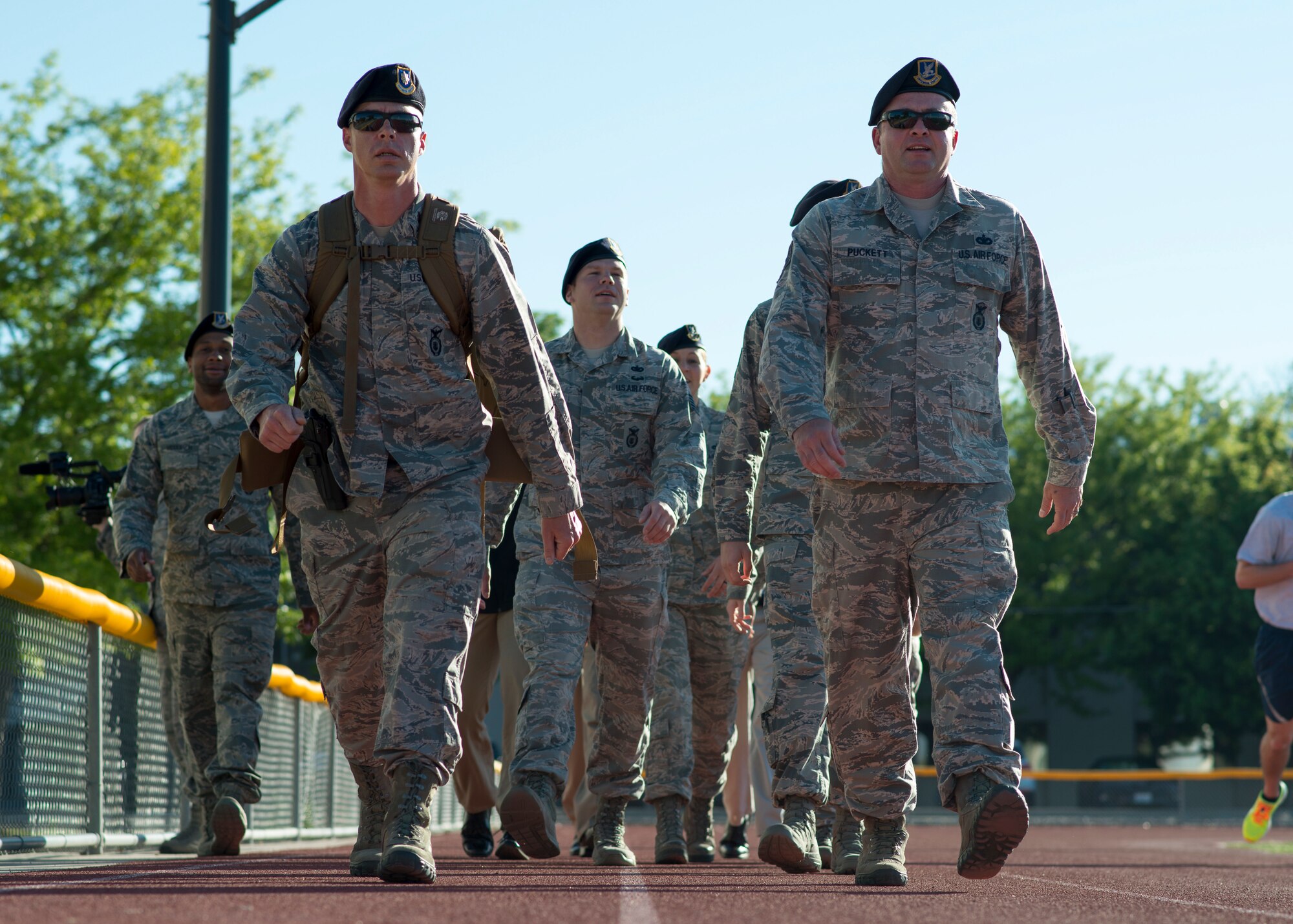 Defenders from the 366th Security Forces Squadron ruck march around the base track May 14, 2018, at Mountain Home Air Force Base, Idaho. The ruck march was performed 24 hours a day, May 14-18, in honor of the 14 defenders who lost their lives since 9/11.. (U.S. Air Force Photo by Airman 1st Class JaNae Capuno)