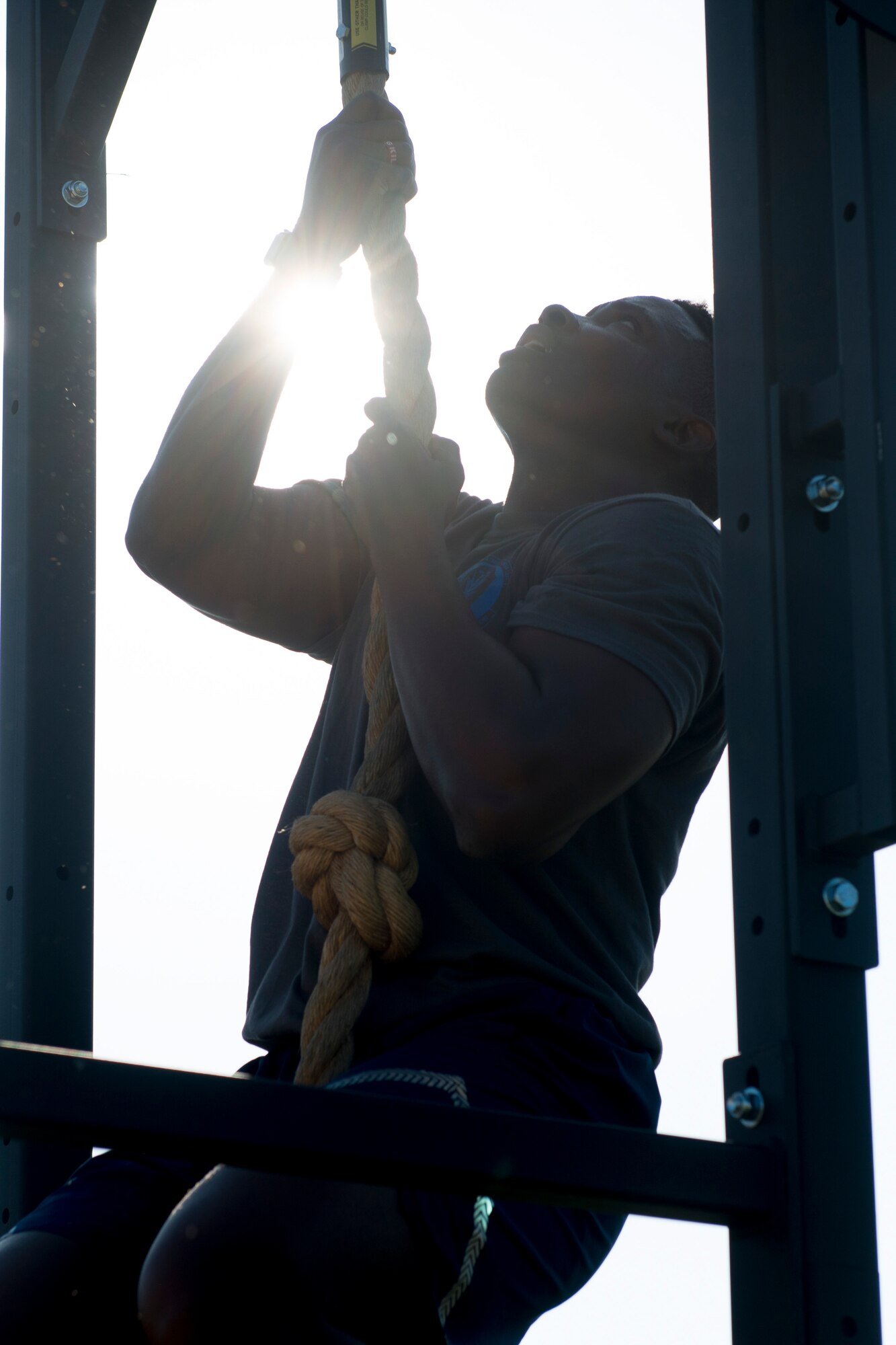 Staff Sgt. Ramir Looney, 366th Security Forces Squadron investigator, performs a rope climb during the National Police Week memorial workout, May 15, 2018, at Mountain Home Air Force Base, Idaho. The memorial workout included 14 workouts and 14 repetitions to honor the fallen defenders. (U.S. Air Force Photo by Airman 1st Class JaNae Capuno)