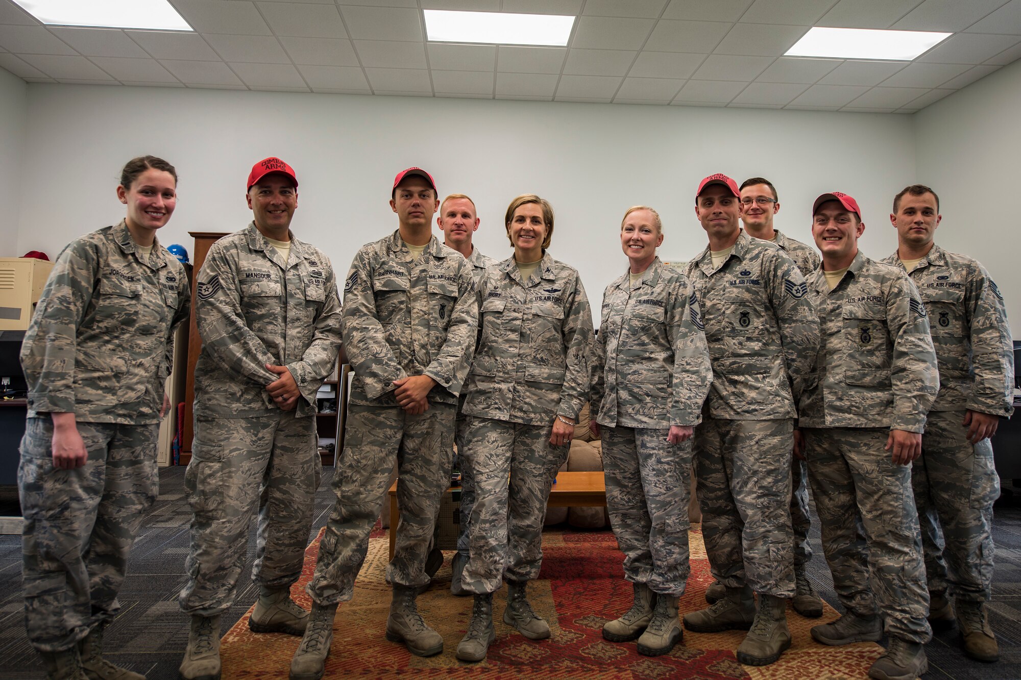 Airmen from the 23d Mission Support Group (MSG) pose for a photo with Col. Jennifer Short, 23d Wing commander, during an immersion tour, May 21, 2018, at Moody Air Force Base, Ga. Short toured the 23d Mission Support Group (MSG) to gain a better understanding of their overall mission, capabilities, and comprehensive duties. Short was able to meet and interact with Airmen from the combat arms training and maintenance as well as the chemical, biological, radiological and nuclear defense sections of the MSG. (U.S. Air Force photo by Airman 1st Class Eugene Oliver)