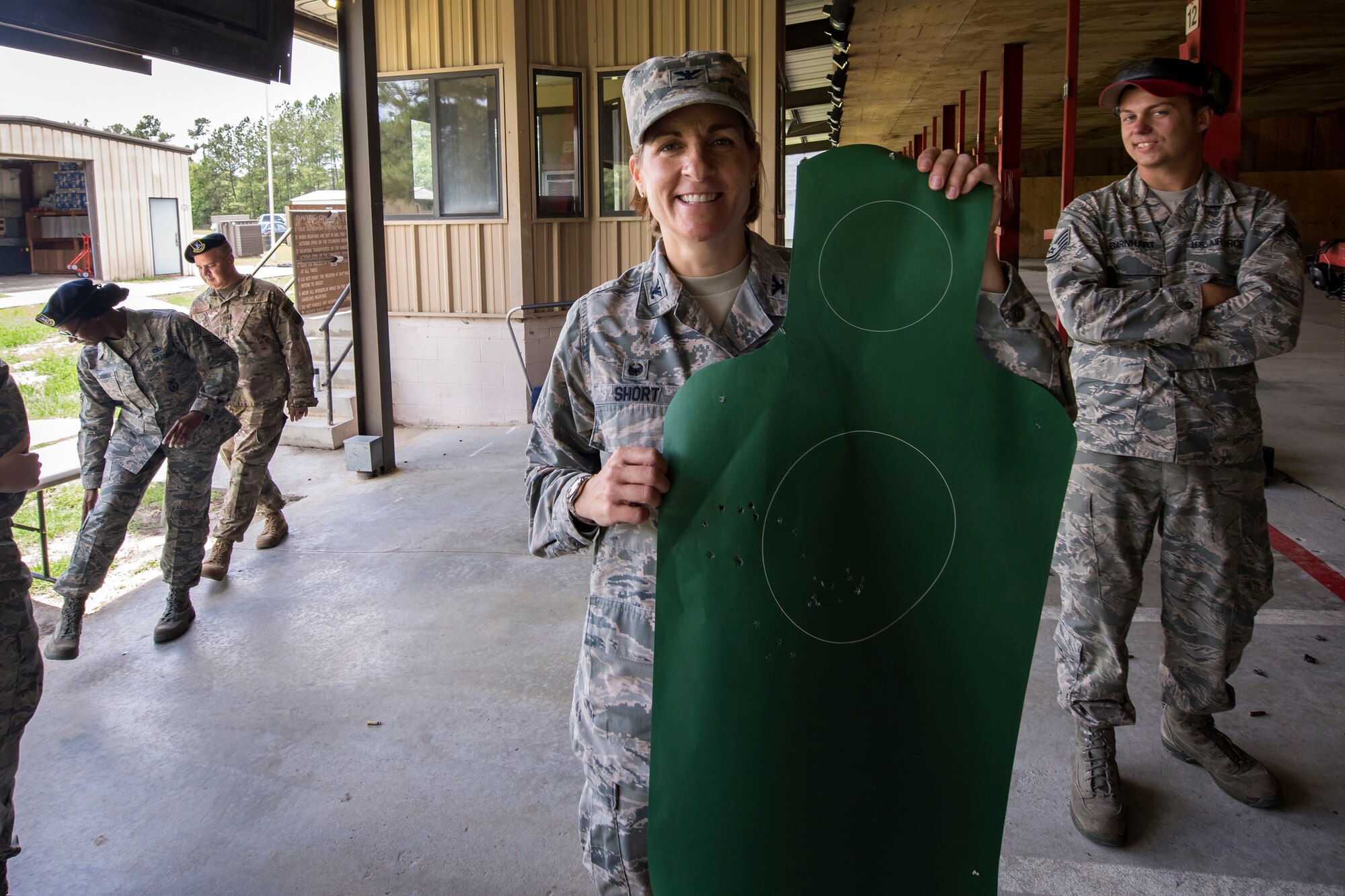 Col. Jennifer Short, 23d Wing commander, poses for a photo with her target sheet during an immersion tour, May 21, 2018, at Moody Air Force Base, Ga. Short toured the 23d Mission Support Group (MSG) to gain a better understanding of their overall mission, capabilities, and comprehensive duties. Short was able to meet and interact with Airmen from the combat arms training and maintenance as well as the chemical, biological, radiological and nuclear defense sections of the MSG. (U.S. Air Force photo by Airman 1st Class Eugene Oliver)