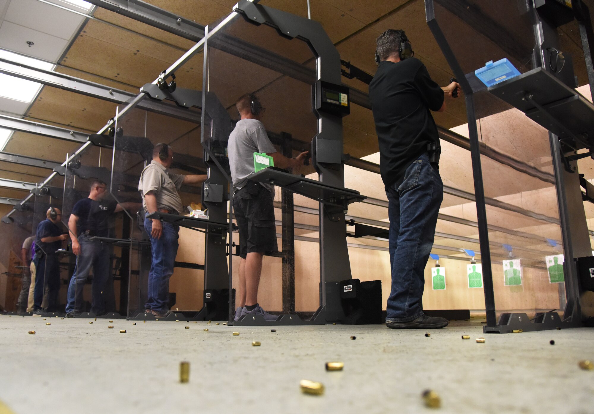 Keesler personnel and members of the local law enforcement participate in the 81st Security Forces Squadron law enforcement team competition shoot in the indoor firing range at Keesler Air Force Base, Mississippi, May 16, 2018. The event was held during National Police Week, which recognizes the service of law enforcement men and women who put their lives at risk every day. (U.S. Air Force photo by Kemberly Groue)