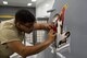 U.S. Air Force Senior Airman Israel Marrufo, 20th Equipment Maintenance Squadron corrosion control specialist, peels paper off a Wild Weasel decal at Shaw Air Force Base, S.C., May 16, 2018.