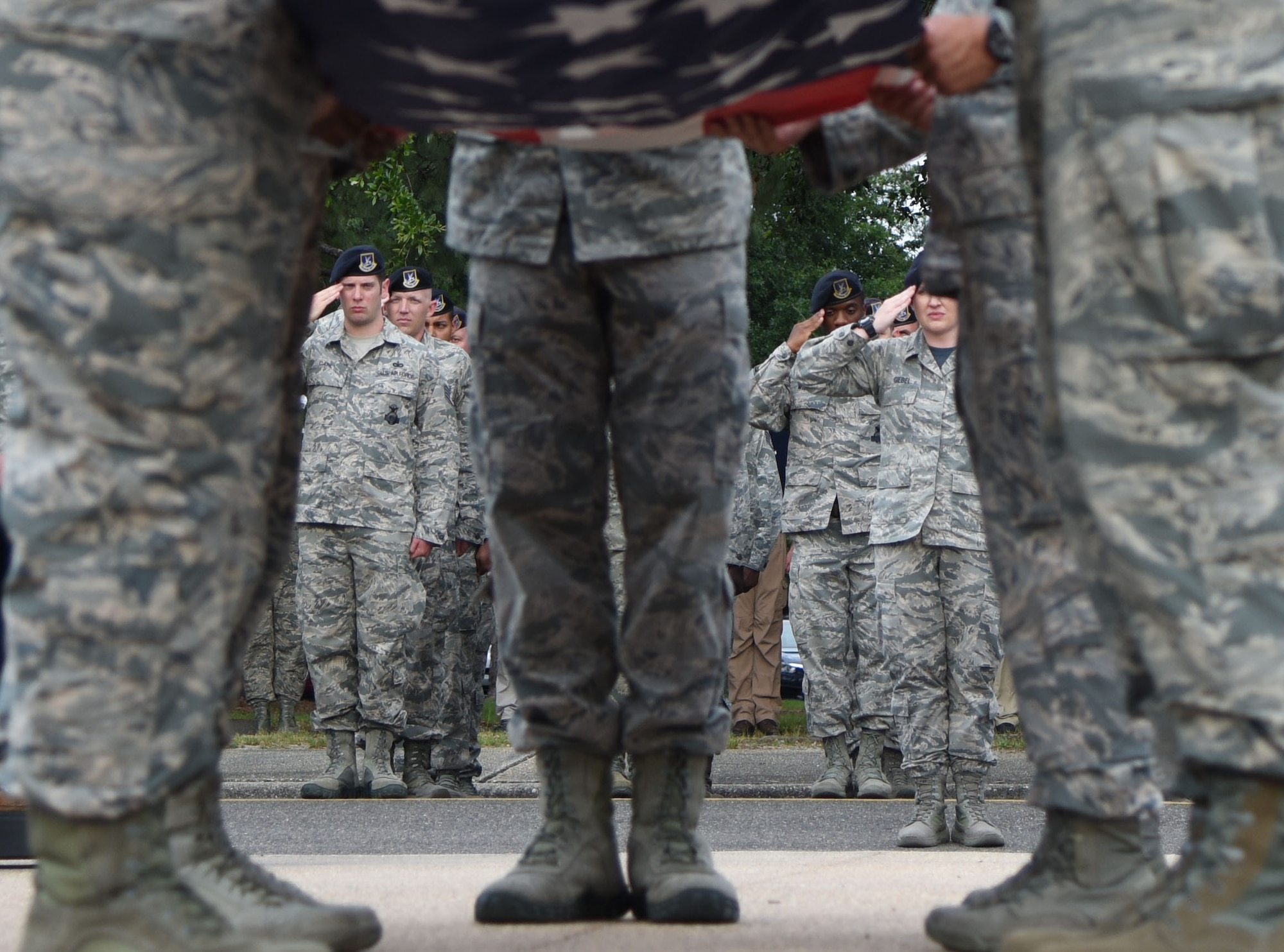 Members of the 81st Security Forces Squadron participate in the 81st SFS retreat ceremony at Keesler Air Force Base, Mississippi, May 18, 2018. The event was held during National Police Week, which recognizes the service of law enforcement men and women who put their lives at risk every day. (U.S. Air Force photo by Kemberly Groue)