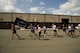 Airmen from 515th Air Mobility Operations Wing run in formation during the 5th Annual Port Dawg Memorial Run at Joint Base Pearl Harbor-Hickam, Hawaii, May 18, 2018. The purpose of the run was to honor and remember fallen Port Dawgs, Airmen who lost their lives in the air transportation career field. (Photo by Tech. Sgt. Heather Redman)