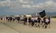 Airmen from 515th Air Mobility Operations Wing run in formation during the 5th Annual Port Dawg Memorial Run at Joint Base Pearl Harbor-Hickam, Hawaii, May 18, 2018. The purpose of the run was to honor and remember fallen Port Dawgs, Airmen who lost their lives in the air transportation career field. (Photo by Tech. Sgt. Heather Redman)