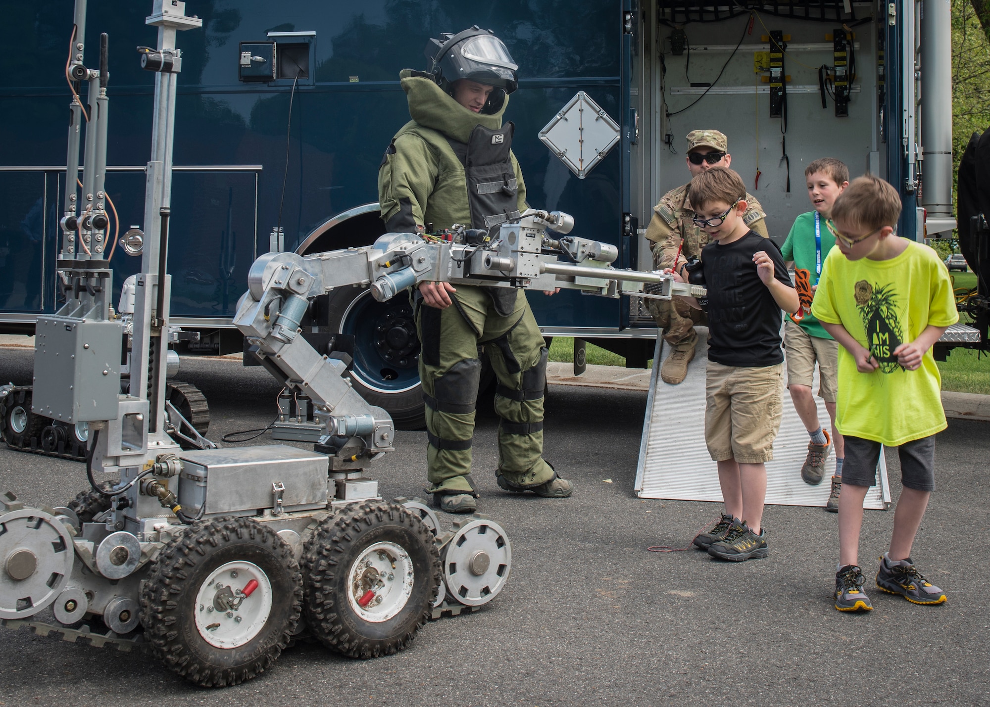 Airman 1st Class Kyle Riley, 92nd Civil Engineer Squadron Explosive Ordnance Disposal apprentice, shows Michael Anderson Elementary student’s EOD tools during the National Police Week Law Enforcement Exposition at Fairchild Air Force Base, Washington, on May 16, 2018. The 92nd CES EOD, military working dogs and the Spokane Police Department provided children with hands-on demonstrations.