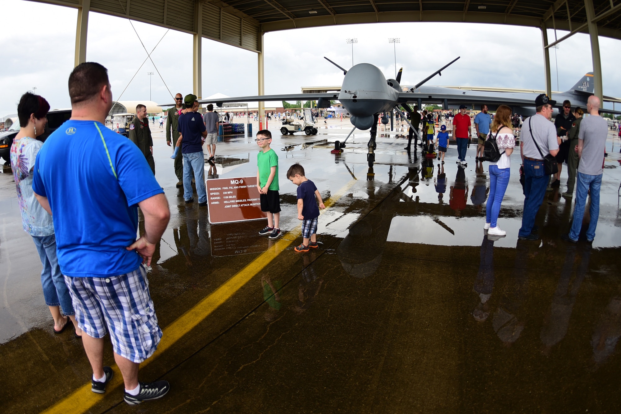 Airpower Over Hampton Roads spectators check out the MQ-9 Reaper at Joint Base Langley-Eustis, Virginia, May 20, 2018. Cloudy skies and rain did not deter visitors from paying a visit to JBLE over the air show weekend. (U.S. Air Force photo by Airman 1st Class Haley Stevens)