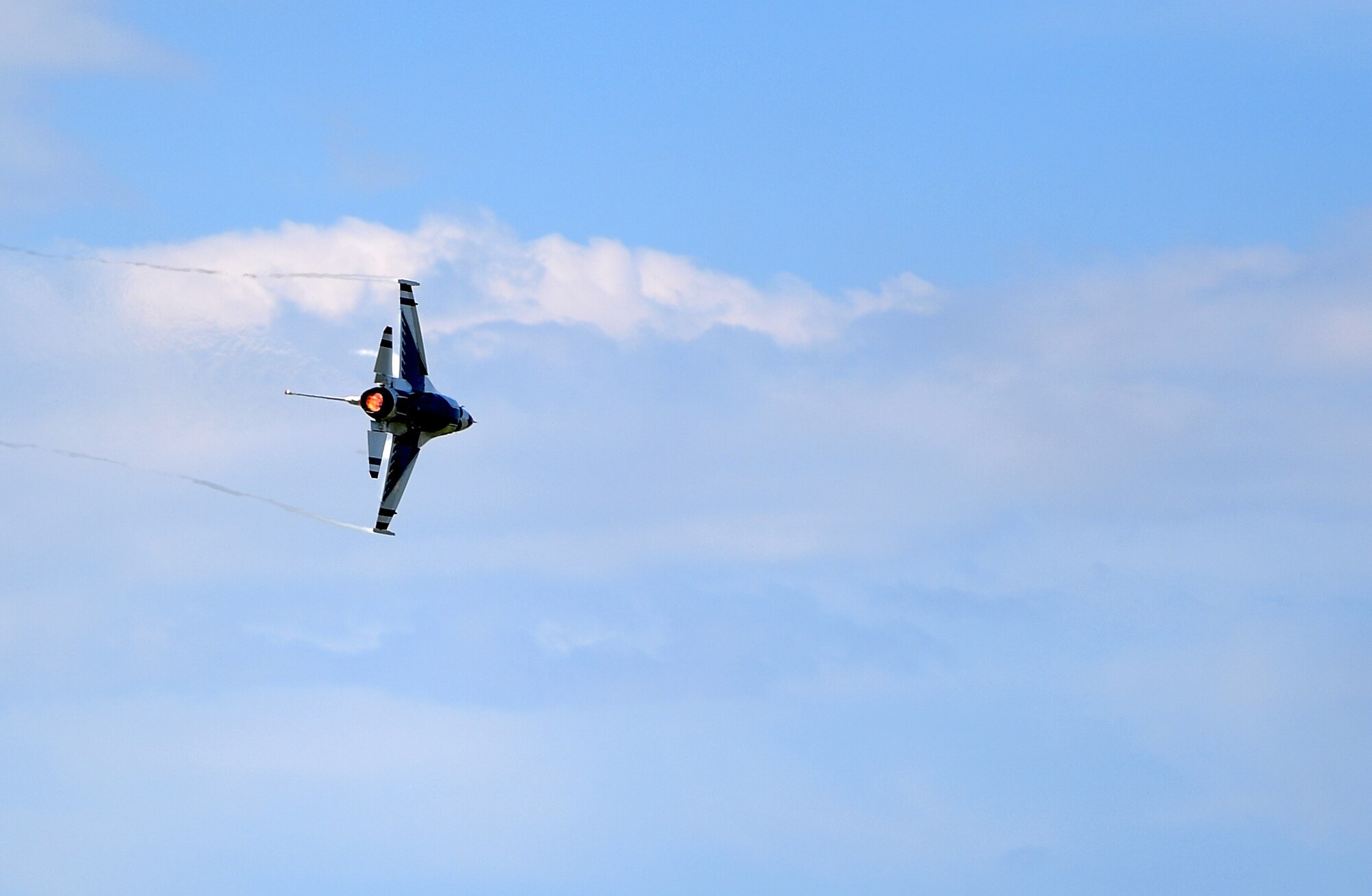 A U.S. Air Force Thunderbird performs during the Airpower Over Hampton Roads air show at Joint Base Langley-Eustis, Virginia, May 20, 2018. This performance marked the first Thunderbirds demonstration since the start of this air show season. (U.S. Air Force photo by Senior Airman Christian Clausen)