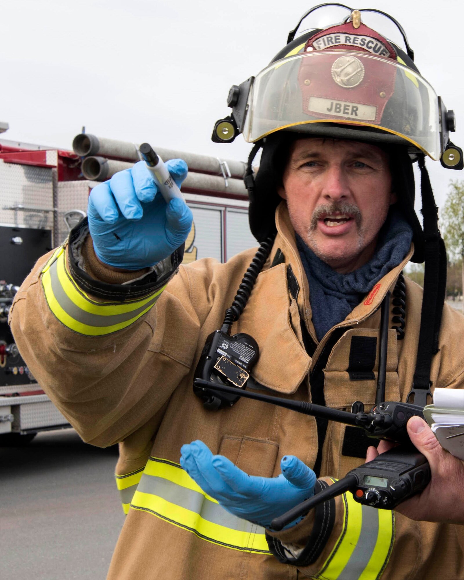 Louis Larousse, 673d Civil Engineer Squadron (CES) fire and emergency services crew chief, directs Airmen firefighters during an active-shooter exercise at Joint Base Elmendorf-Richardson, Alaska, May 17, 2018. Larousse is a crew chief for Fire Engine #2 and was a lead participant in the exercise in preparations for the Arctic Thunder Open House scheduled to take place June 30 and July 1. Airmen from the Alaska Air National Guard’s 176th Wing and the 673d CES fire and emergency services participated in the exercise to test their capabilities in challenging circumstances and provide training for possible incidents.