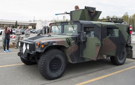 Attendees participate at a demonstration for Police Week on Joint Base Elmendorf-Richardson, Alaska, May 15, 2018. The event included 673d Security Forces Squadron military working dog demonstrations, Drug Abuse Resistance Education officers, weapons demonstration and a Humvee. Police Week is a congressionally honored week for law enforcement personnel across the nation and around the world who have made the ultimate sacrifice in the line of duty.
