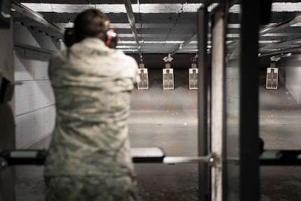 Air Force Staff Sgt. Adam Stanley, 673d Security Forces Squadron supply noncommissioned officer in charge, prepares to shoot at a target for the Police Shooting Competition during Police Week on Joint Base Elmendorf-Richardson, Alaska, May 17, 2018. The competition was for all SFS members, Military Police and local police to showcase their marksmanship skills.