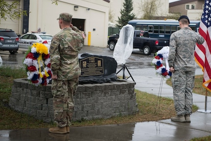 Members of Joint Base Elmendorf-Richardson salute memorial wreaths at the closing ceremony for Police Week on JBER, Alaska, May 18, 2018. National Police Week is a congressionally honored week for law enforcement personnel across the nation and around the world who have made the ultimate sacrifice in the line of duty.
