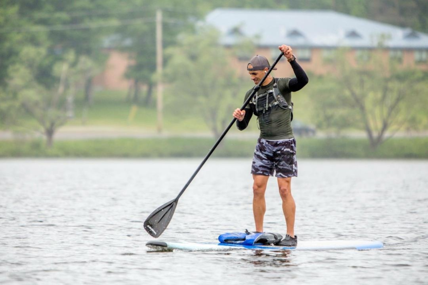 Sgt. 1st Class Mark Jones, infantryman, Army Mountain Warfare School, Vermont National Guard, practices paddle boarding for physical fitness training.
