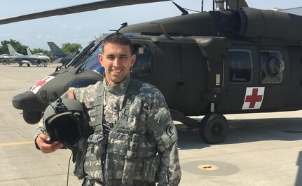 Capt. Dan Davis, Charlie Company, 3rd Battalion, 126th Aviation Regiment (Air Ambulance), Vermont Army National Guard, poses for a photograph.