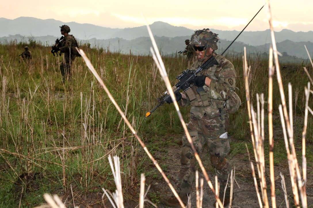 Soldiers conduct a patrol before a combined arms live-fire exercise.