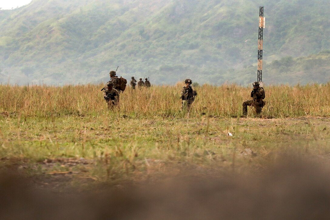 Soldiers patrol to a follow-on firing point.