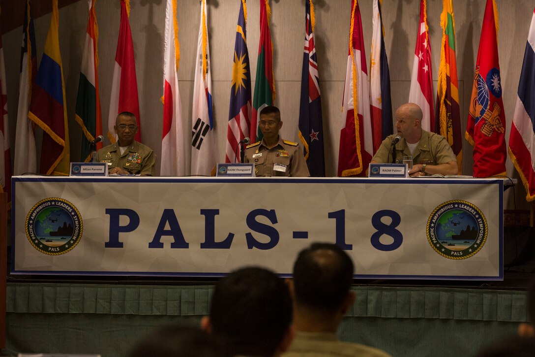 Philippine Marine Corps Maj. Gen. Alvin Parreno, left, commandant, Philippine Marine Corps; Royal Thai Navy Rear Adm. Chatchai Thongsaard, commander, Amphibious and Combat Service Support Squadron; and U.S. Navy Rear Adm. John Palmer, director, Logistics, Fleet Supply and Ordnance, U.S. Pacific Fleet, discuss logistics support to amphibious operations to senior military leaders during the Pacific Amphibious Leaders Symposium (PALS) 2018 in Honolulu, Hawaii, May 22, 2018. PALS brings together senior leaders of allied and partner militaries with significant interest in the security and stability of the Indo-Pacific region to discuss key aspects of maritime/amphibious operations, capability development, crisis response, and interoperability. (U.S. Marine Corps photo by photo Cpl. Makenzie Fallon)