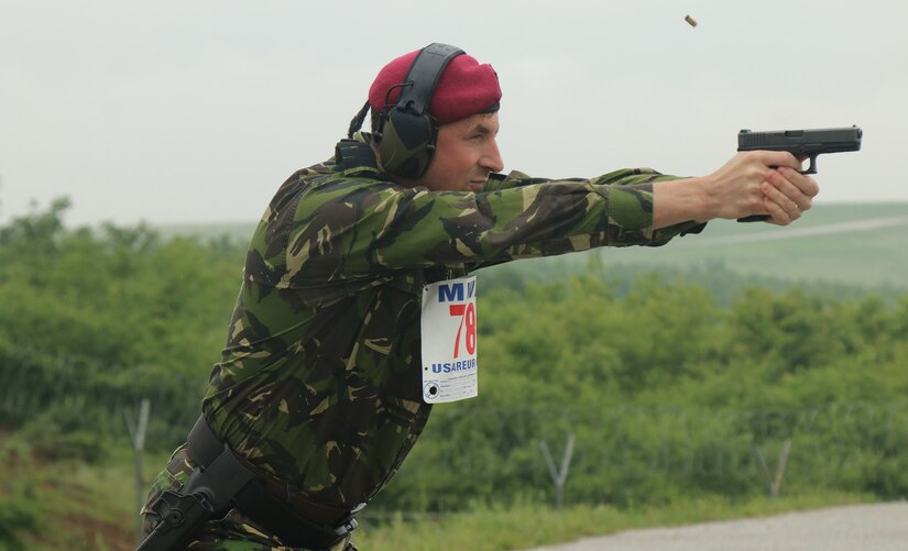oan Vorincita, with the Roman contingent, fires the 9MM pistol