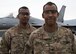 Senior Airman Elliot Briggs (left), a maintenance analyst technician with the 455th Expeditionary Maintenance Group, and Spc. Leon Briggs, a vehicle mechanic with the 1-87th Infantry Battalion, 10th Mountain Infantry Division, pose for a photo at Bagram Airfield, Afghanistan, May 12. The deployment to Afghanistan is the first time the two brothers have been deployed to the same location since enlisting. (U.S. Air Force photo/Tech. Sgt. Eugene Crist)