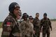 Royal Moroccan Armed Forces service members and 435th Contingency Response Group Airmen watch a Super Hercules C130-J after completing a combat offload training for Exercise African Lion 18, April 23, 2018 at Kenitra Air Base, Morocco.