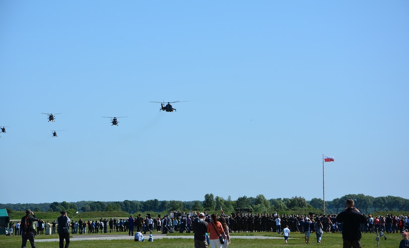 Soldiers and three helicopters from the 12th Combat Aviation Brigade