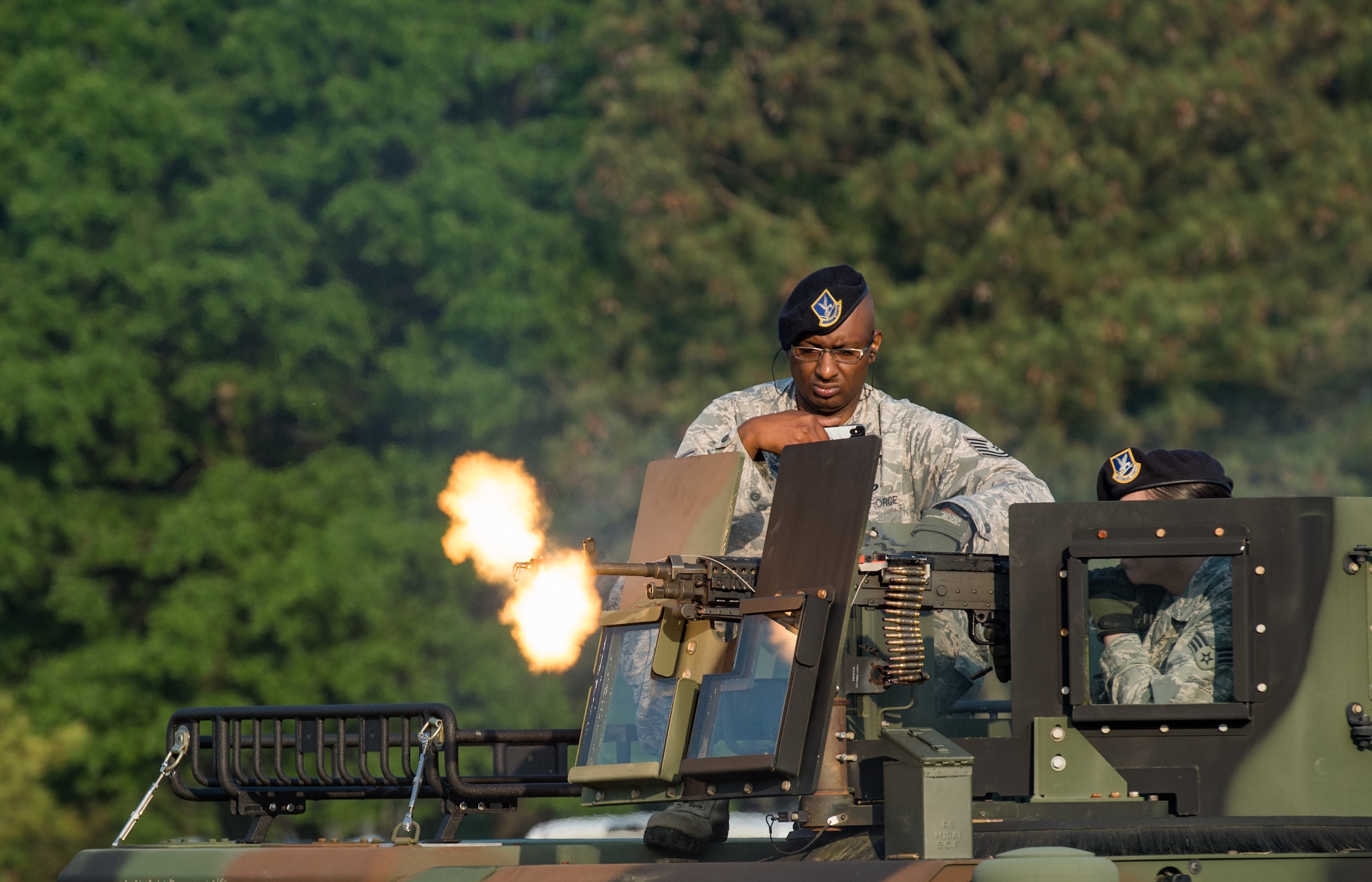 U.S. Air Force 633rd Security Forces Squadron Airmen, fire blank rounds during the National Police Week opening ceremony at Joint Base Langley-Eustis, Virginia, May 14, 2018.