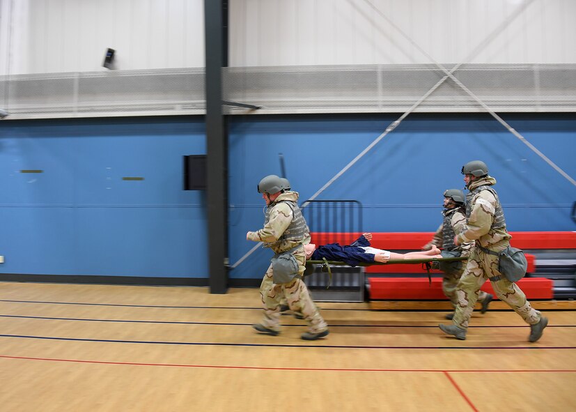 A team from the 319th Communications Squadron demonstrates a litter carry during a readiness competition May 18, 2018, on Grand Forks Air Force Base, North Dakota. In addition to the litter carry, each team was scored based on their ability to read a map and determine coordinates. (U.S. Air Force photo by Airman 1st Class Elora J. Martinez)