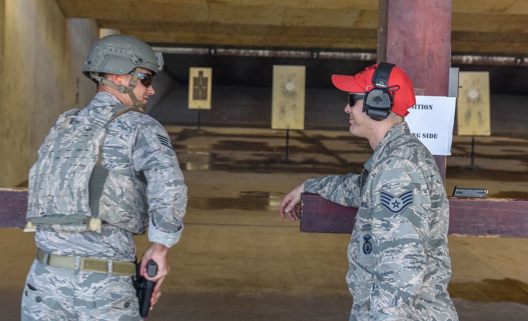 CATM instructors Airman before firing M9 pistol