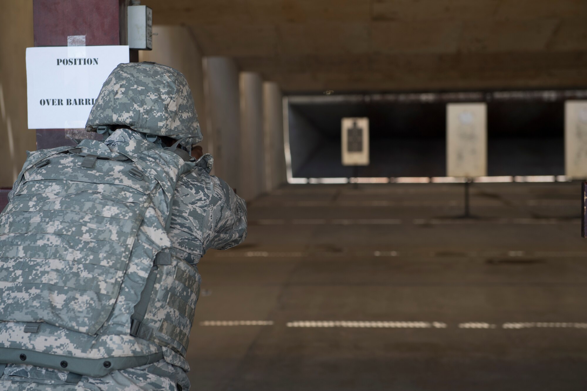 Airman shoots pistol during competition.