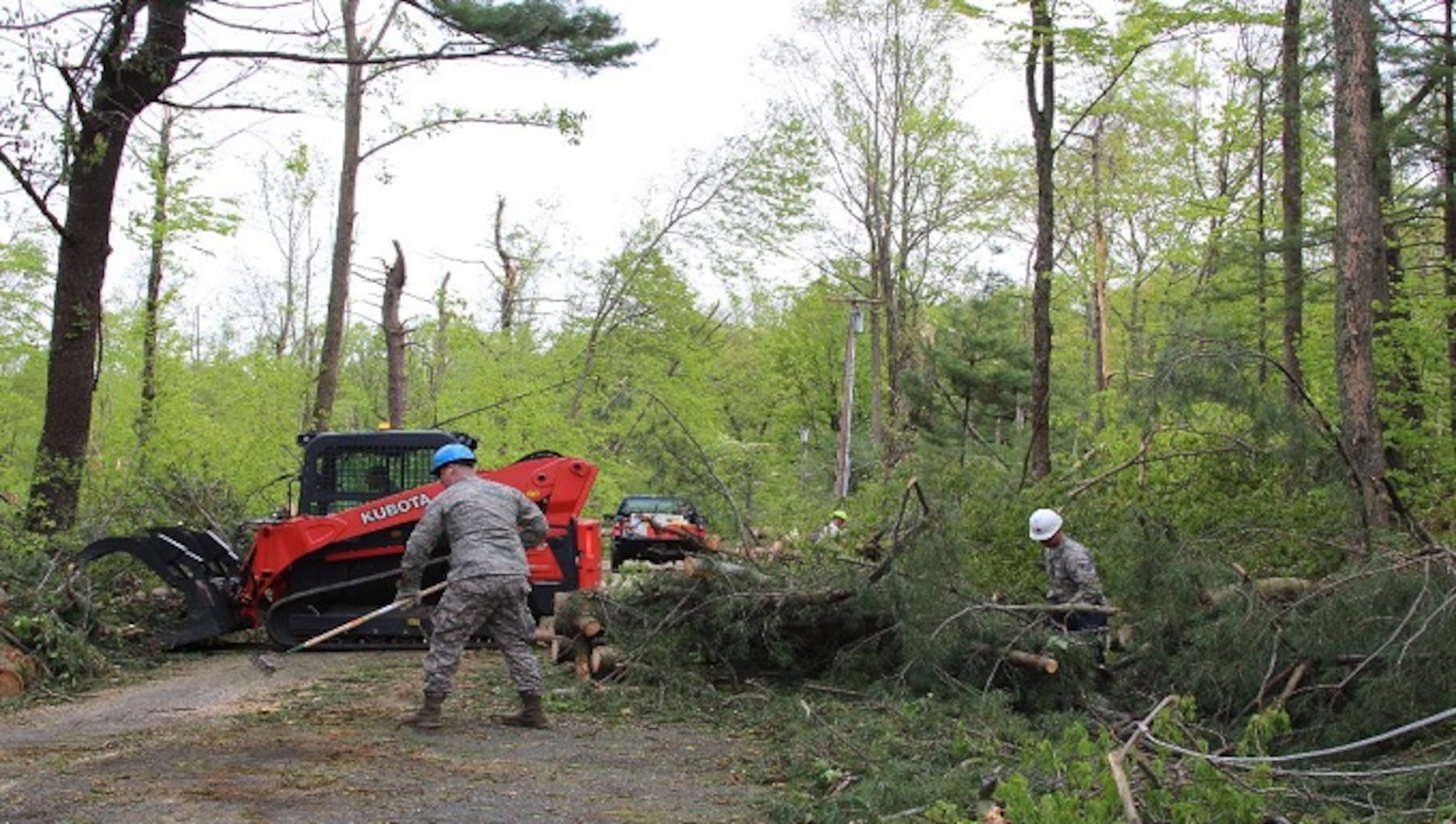 Airmen from the 103rd Civil Engineering Squadron begin clearing Downs Road May 18, 2018 in Bethany, Conn. The Connecticut National Guard was activated to assist local and state agencies from the devastation cause by the storm May 15, 2018. (U.S. Air National Guard photo by 1st Lt. Jen Pierce/released)