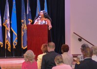 Stephanie Solomon, 633rd Air Base Wing contractor, sings the National Anthem as attendees stand during the Bronze Cross Memorial and Wreath Laying Ceremony at Joint Base Langley-Eustis, Virginia, May 19, 2018. Community members and Gold Star families gathered together to honor fallen heroes who made the ultimate sacrifice. (U.S. Air Force photo by Beverly Joyner)