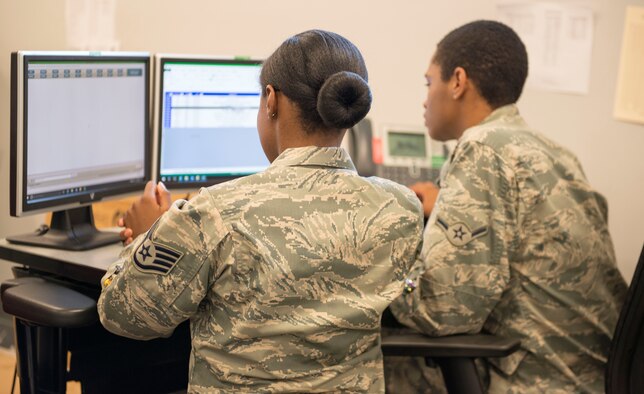 U.S. Air Force Staff Sgt. Jhodeci Redmon, 20th Maintenance Group (MXG) scheduling noncommissioned officer in charge, and Airman Jawonn McClary, 20th MXG scheduler, pull an aircraft out of configuration for inspection at Shaw Air Force Base (AFB), S.C., May 21, 2018. All inspections for aircraft assigned to Shaw AFB are tracked by the scheduling team to ensure pilot and maintainer safety. (U.S. Air Force photo by Airman 1st Class Benjamin Ingold)
