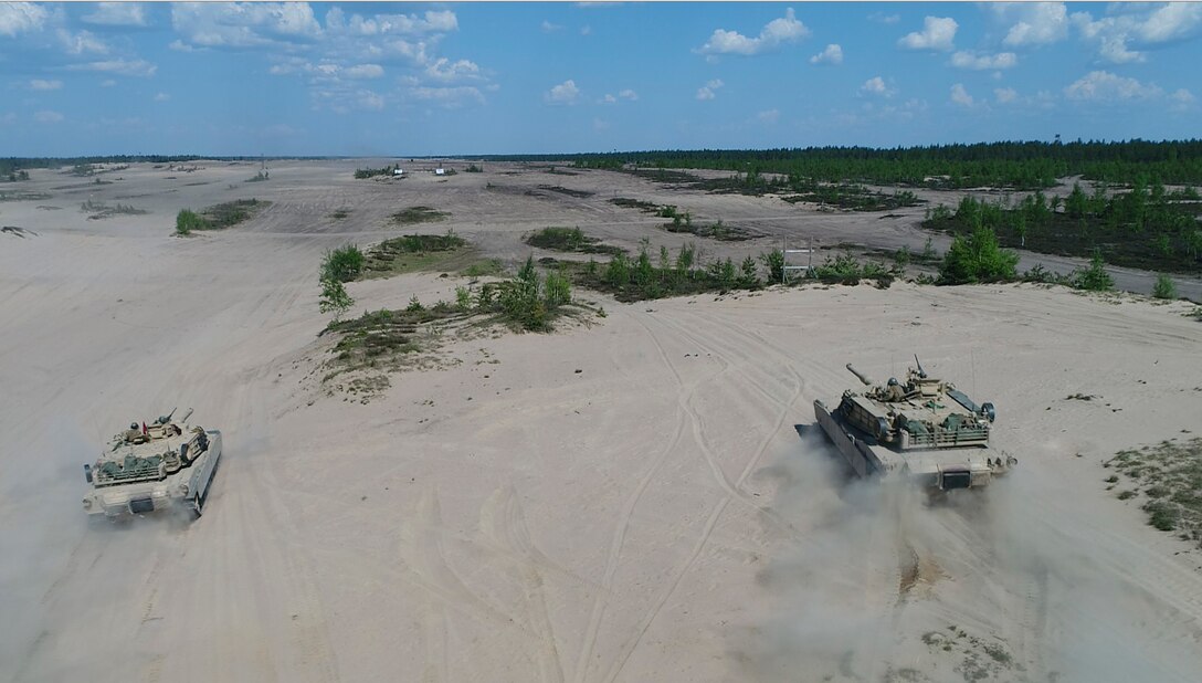 Marines with Bravo Company, 4th Tanks Battalion, drive the M1A1 Abrams tanks during a live-fire exercise as part of Exercise Arrow 18 in Pohjankangas Training Area near Kankaanpaa, Finland, May 15, 2018. Exercise Arrow is an annual Finnish multi-national exercise with the purpose of training with mechanized infantry, artillery, and mortar field training skills in a live-fire exercise. This is the first year the Marine Corps is participating in this exercise and the first time the M1A1 Abrams tanks have been in Finland. (U.S. Marine Corps photo by Staff Sgt. Marcin Platek/Released)