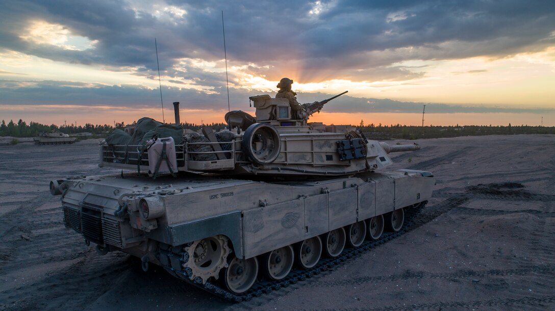 Marines with Bravo Company, 4th Tanks Battalion, prepare to fire a M1A1 Abrams tank during a low-light live-fire exercise as part of Exercise Arrow 18 in Pohjankangas Training Area near Kankaanpaa, Finland, May 16, 2018. Exercise Arrow is an annual Finnish multi-national exercise with the purpose of training with mechanized infantry, artillery, and mortar field training skills in a live-fire exercise. This is the first year the Marine Corps is participating in this exercise and the first time the M1A1 Abrams tanks have been in Finland. (U.S. Marine Corps photo by Staff Sgt. Marcin Platek/Released)